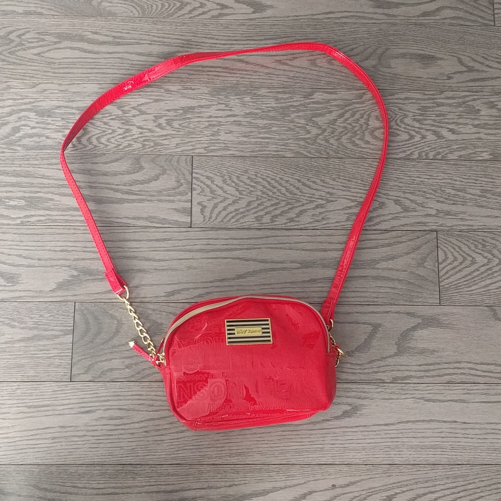 Beautiful red shoulder bag by Betesy Johnston
